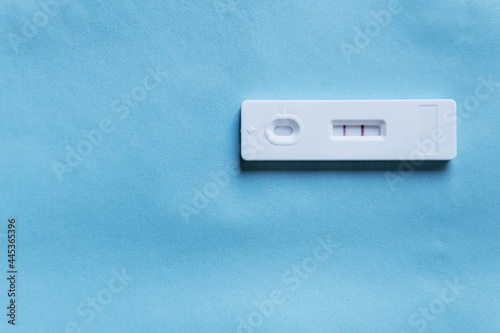 Pregnancy test on a color background. Close-up. There is free space.