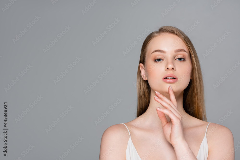 pretty young woman with makeup isolated on grey pretty young woman with makeup isolated on grey
