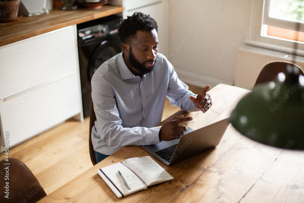 African American businessman working from home on a video call African American businessman working from home on a video call