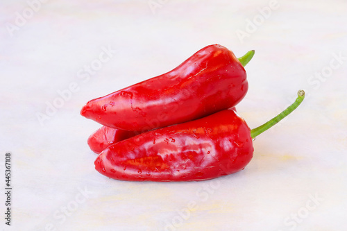 Red pepper on a white wooden background