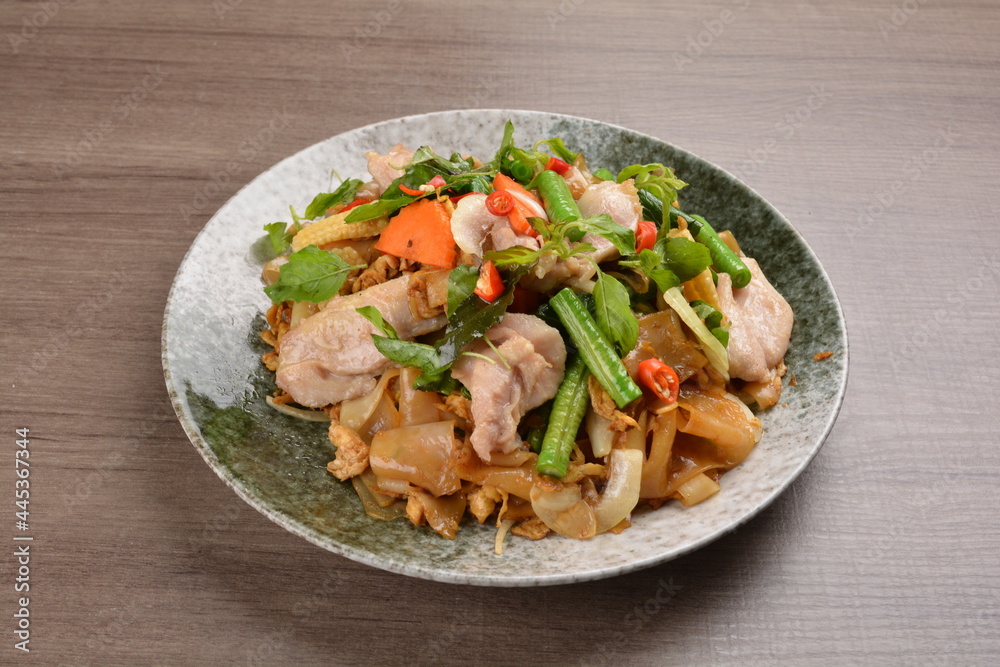 wok fried noodle phad Thai with chicken meat on wood background asian halal set lunch menu wok fried noodle phad Thai with chicken meat on wood background asian halal set lunch menu