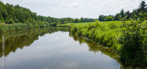 Nice hole with river on a Canadian golf club in Quebec, on the countryside