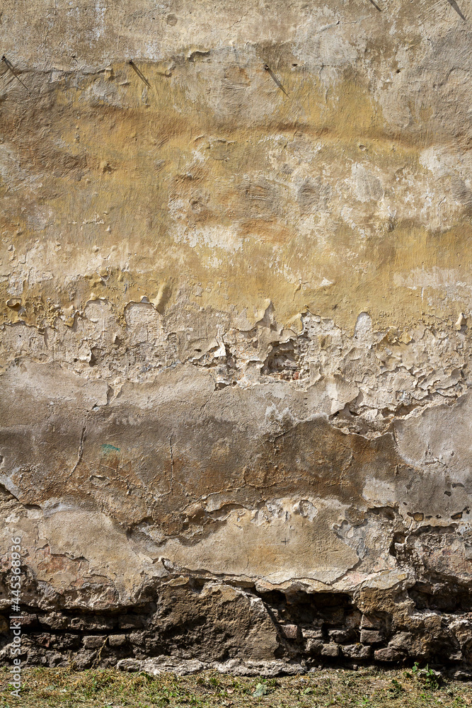 Old yellow plaster and brick wall Old yellow plaster and brick wall