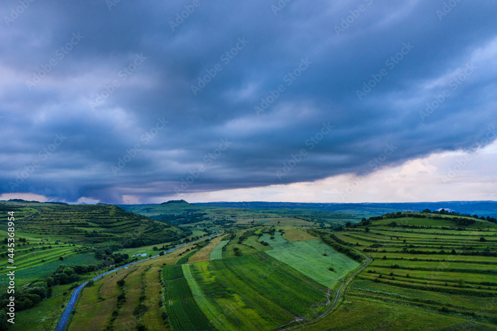 Aerial view of a storm and clouds above a village