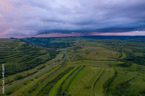 Aerial view of a storm and clouds above a village