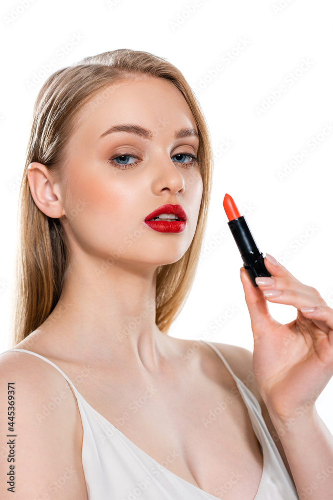 pretty young woman with red lips holding lipstick tube isolated on white pretty young woman with red lips holding lipstick tube isolated on white