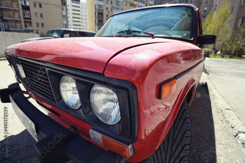 headlight of a red vintage car