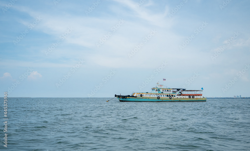 Tourism ship on the ocean and blue sky landscape,Travel boat concept for transport traveler in Thailand with beautiful sea and sky Tourism ship on the ocean and blue sky landscape,Travel boat concept for transport traveler in Thailand with beautiful sea and sky