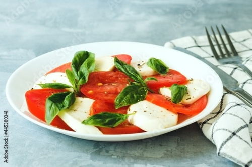 Caprese Salad made of mozzarella, tomatoes and basil