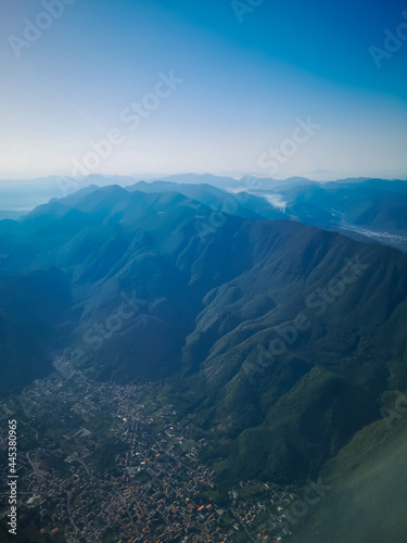 Aerial view from plane to cities and mountains in Italy