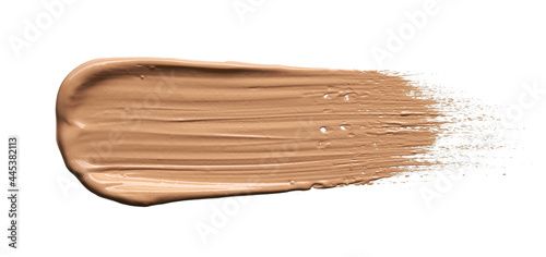 Gently beige strokes and texture of makeup foundation or acrylic paint isolated on white background