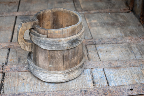 old wooden handmade mug on a wooden table