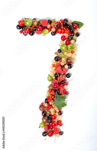 Number seven from real natural berries and leaves. Numbers concept made from berries. Summer creative concept.