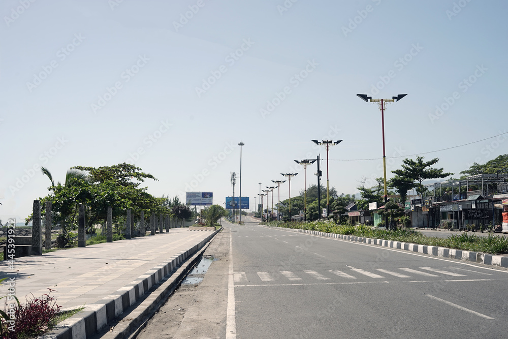 Shot in Padang City, West Sumatra, Indonesia on July 15th, 2021. Empty street during qurantine day due to covid-19 outbreak. 