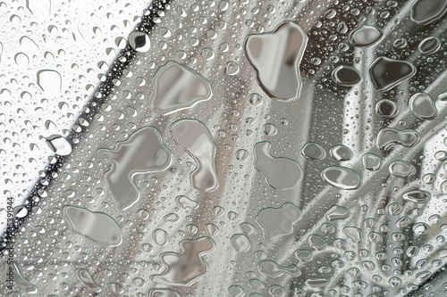 Raindrops on glass, bottom view, wet glass ceiling. copy space for text