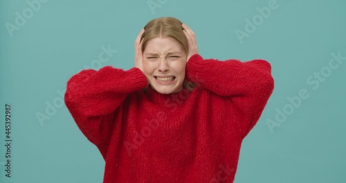 Young woman losing temper and closing her ears to express disapproval, unwilling to listen