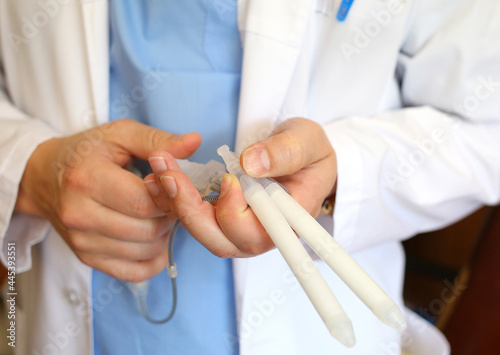 Doctor andrologist holding hydraulic penile prosthesis for falloprosthetics. Penile prosthesis. Urology and Andrology. Health male concept