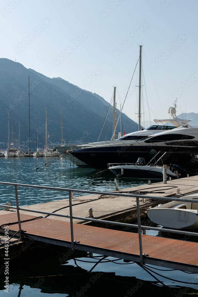 Fototapeta premium a modern yacht in the port of Kotor at sunset. Kotor. Montenegro 12.07.2021