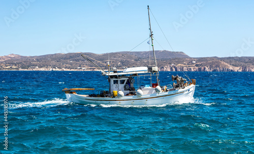 Fishing boat moving in wavy sea. Cyclades Greece © Rawf8