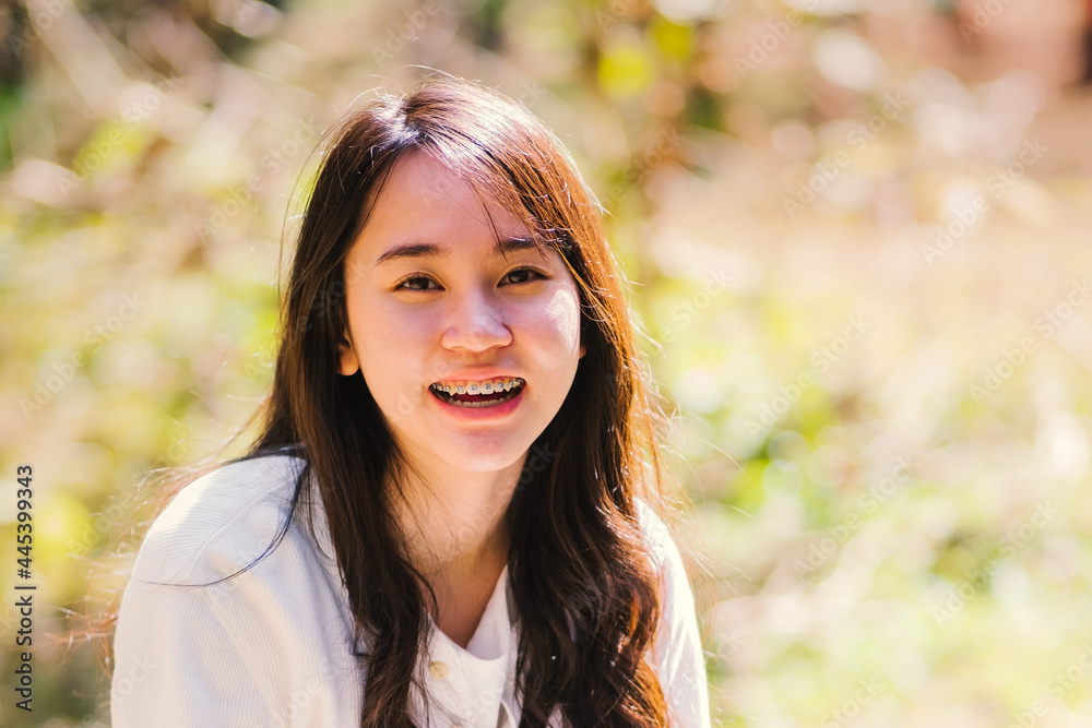 Portrait of a beautiful teenager girl with long hair in the Park, Portrait of a beautiful teenager girl with long hair in the Park,