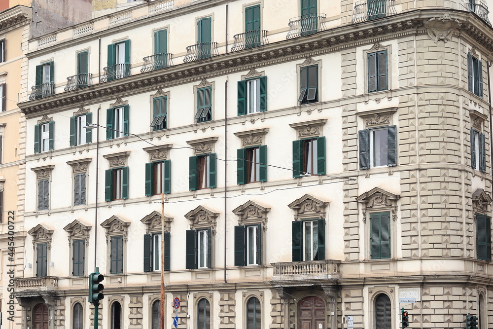 Fototapeta premium Rome Traditional Building Facade with Green Shutters and Iron Balconies, Italy