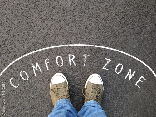 feet in canvas shoes standing inside comfort zone photo