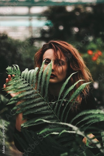 girl with a large fern leaf. mavka. fern. greenery, freshness, forest. photo