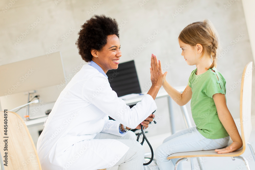 Fototapeta premium Cute little girl at the pediatrician examination