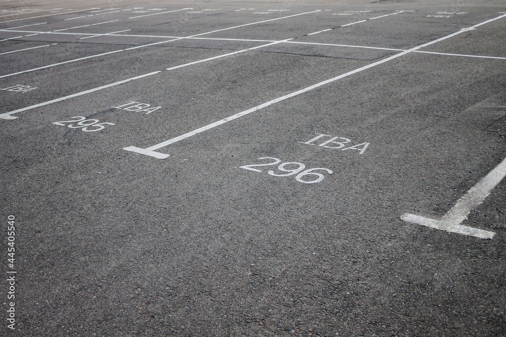 Parking, empty parking lot space on the asphalt - photo.White ink marking lines 
