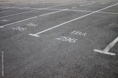 Parking  empty parking lot space on the asphalt - photo.White ink marking lines 