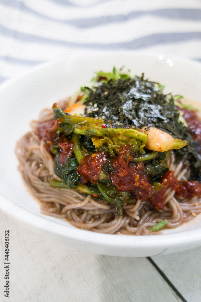 korean spicy buckwheat noodles with various vegetables.