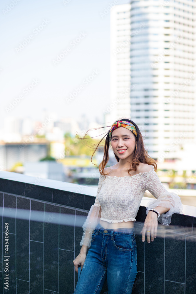 Portrait of sexy Asian woman in sexy top and jeans. Portrait of sexy Asian woman in sexy top and jeans.