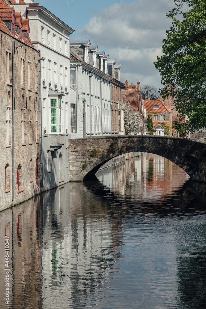 Belgium, West Flanders, Bruges, Medieval arch bridge stretching over city canal Belgium, West Flanders, Bruges, Medieval arch bridge stretching over city canal