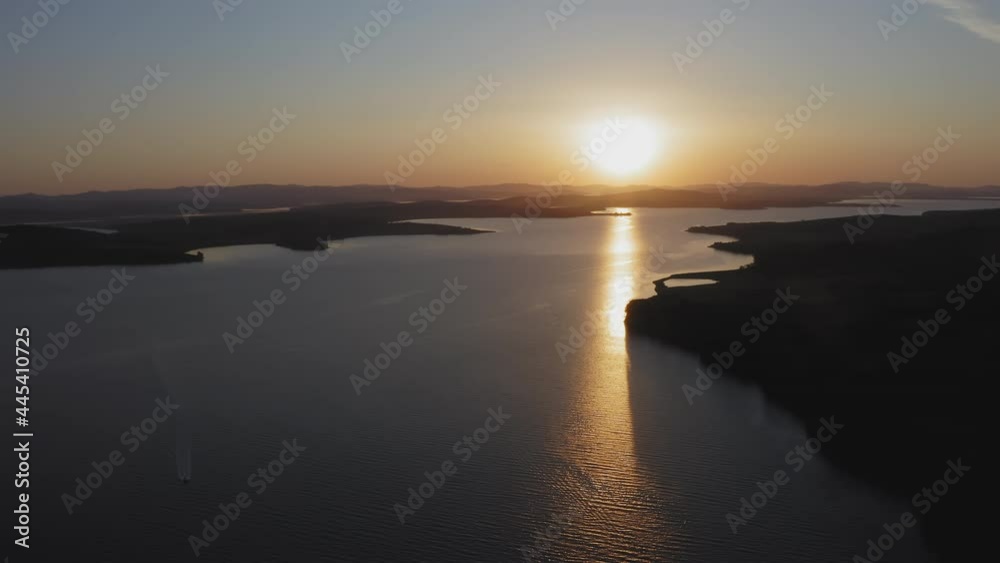 Sunrise over the Sea of Japan. Calm sea in calm, shining reflections Sunrise over the Sea of Japan. Calm sea in calm, shining reflections
