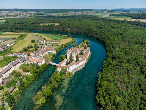 Switzerland, Canton of Zurich, Rheinau, Aerial view of�Rheinau Abbey and surrounding forest in summer photo