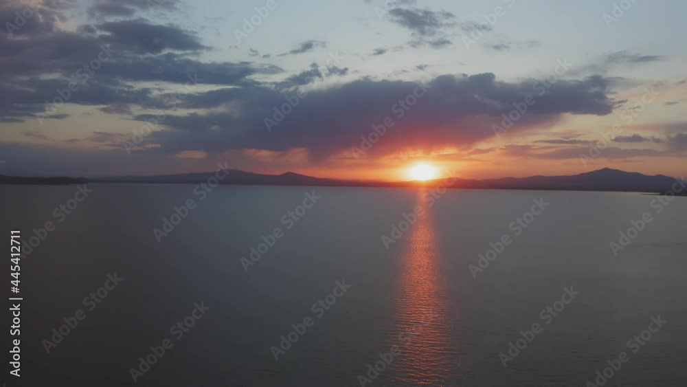 Beautiful sunset over the mountain range on the horizon to the sea. Beautiful sunset over the mountain range on the horizon to the sea.