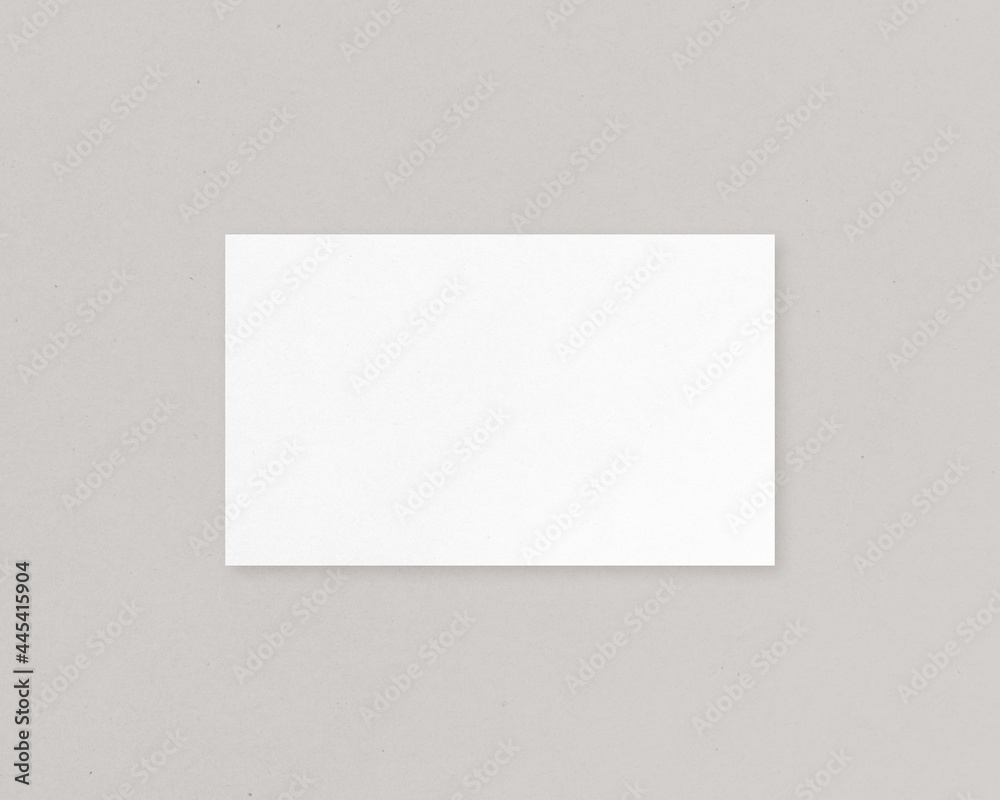Blank white horizontal paper on grey background. Mockup scene. Empty paper photo mockup with clipping path.