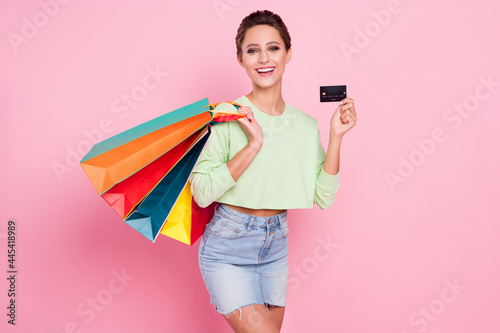 Photo of young girl happy positive smile hold bank card black friday shopping money isolated over pastel color background