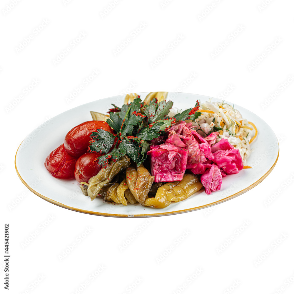Isolated russian pickled fermented vegetables platter with sauerkraut Isolated russian pickled fermented vegetables platter with sauerkraut