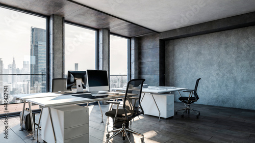 Computers on desks in modern office photo