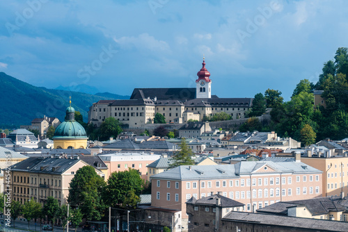 Austria, Salzburg State, Salzburg, Historic old town with dome of Kajetanerkirche and Nonnberg Abbey in background photo