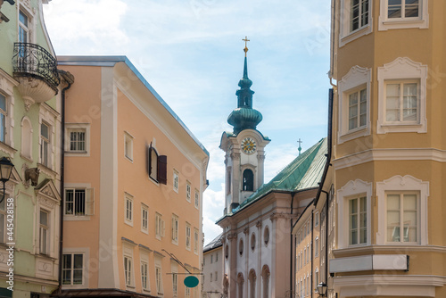 Austria, Salzburg State, Salzburg, Residential buildings in front of Saint Sebastian Church photo