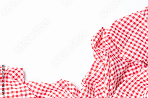 Top view fabric red and white checkered isolated on a white background with copy space. Cloth cotton tablecloth for menu food restaurants.