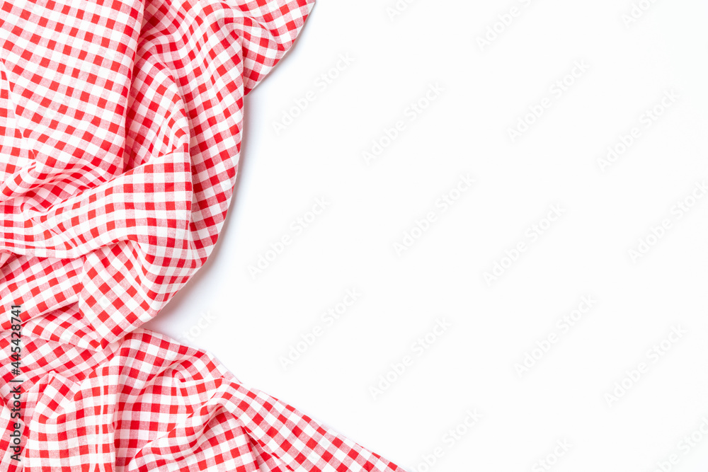 Cloth cotton crumpled tablecloth. Top view fabric red and white checkered isolated on a white background with copy space. Cloth cotton crumpled tablecloth. Top view fabric red and white checkered isolated on a white background with copy space.