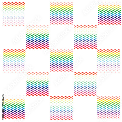 Vector small polka dots that are gradated in rainbow tones into evenly sized discs with white checkered areas.