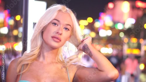 Las Vegas Girl, Young Blonde Woman, Shiny Exterior of Sin City Posing to Camera