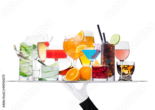 Batler waiter wearing white glove tray with various cocktails with ice isolated on white.Blue lagoon, martini, negroni, mojito, spritz, gimlet, cuba libre, cosmopolitan, margarita. photo