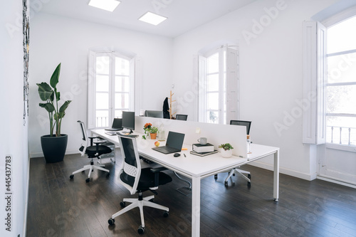 Empty coworking office with hardwood flooring photo