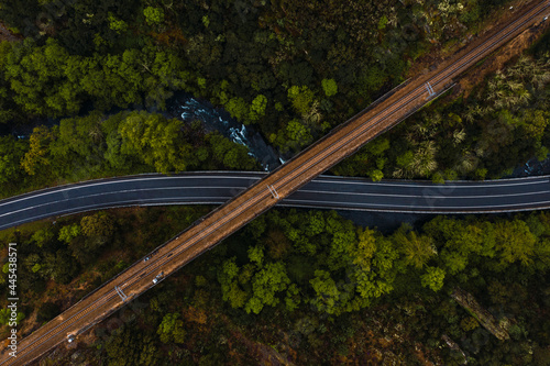 Aerial view of highway stretching under old viaduct photo