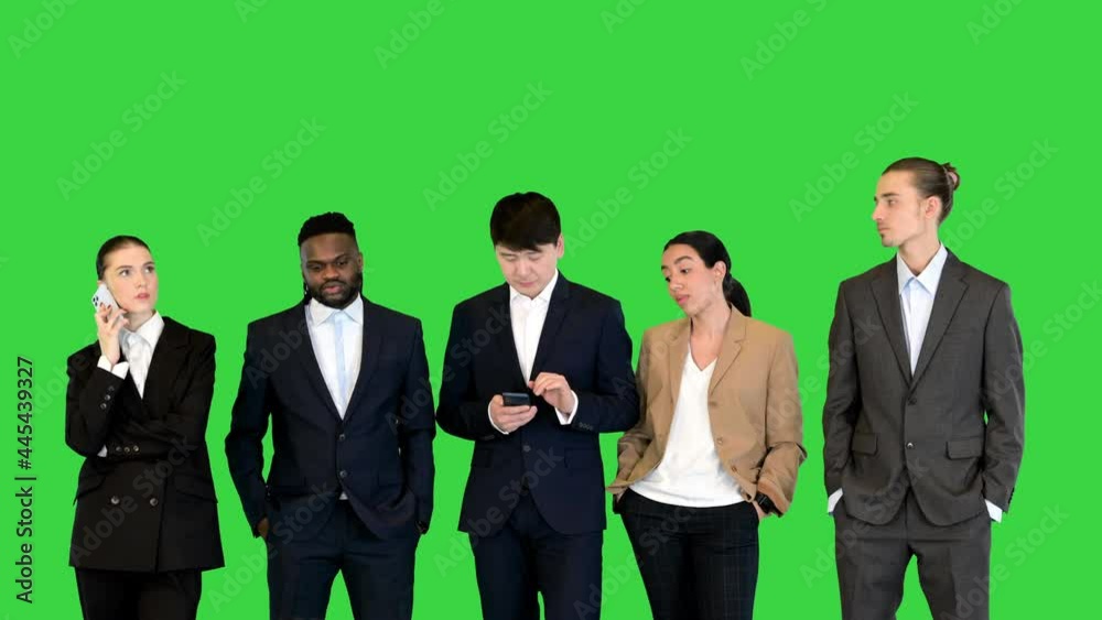 Group of colleages wait, looking at watch, time is running out on a Green Screen, Chroma Key. Group of colleages wait, looking at watch, time is running out on a Green Screen, Chroma Key.